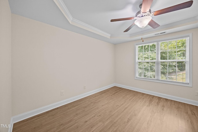 200 Cornerstone Dr, Franklinton, NC 27525 - empty room with a raised ceiling, light wood finished floors, crown molding, and a ceiling fan