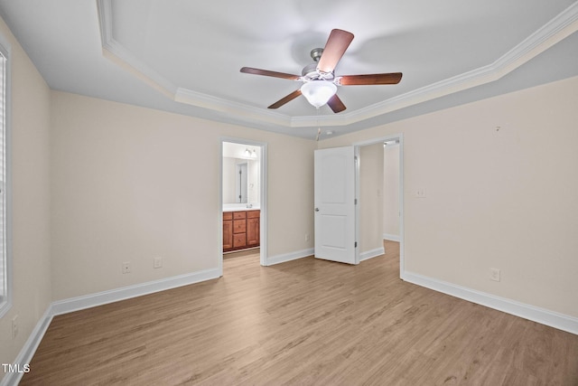 200 Cornerstone Dr, Franklinton, NC 27525 - empty room with a raised ceiling, light wood-style flooring, a ceiling fan, and ornamental molding