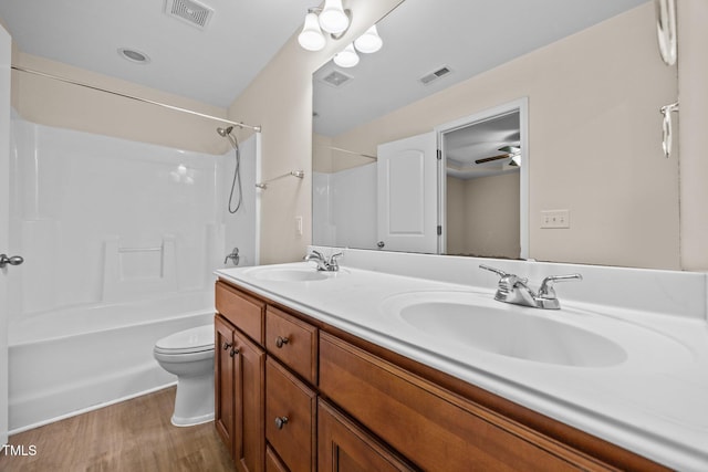 200 Cornerstone Dr, Franklinton, NC 27525 - full bathroom with wood finished floors, double vanity, and bathtub / shower combination