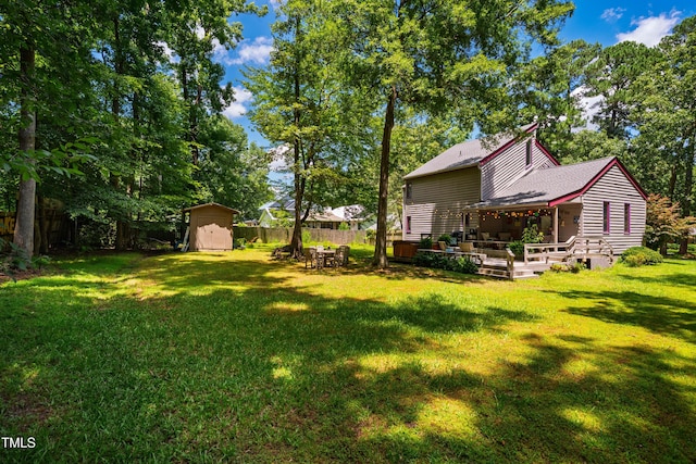 206 Lisa Dr, Carrboro, NC 27510 - fenced backyard featuring a storage unit and a deck