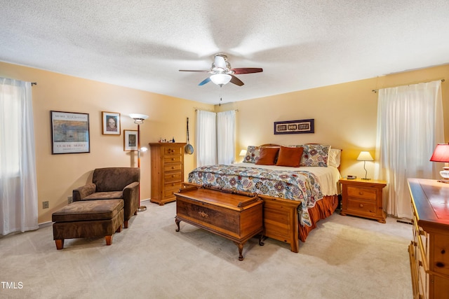 206 Lisa Dr, Carrboro, NC 27510 - bedroom featuring light carpet, ceiling fan, and a textured ceiling