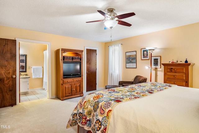 206 Lisa Dr, Carrboro, NC 27510 - bedroom featuring light carpet, ensuite bath, light tile patterned flooring, and ceiling fan