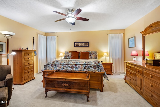 206 Lisa Dr, Carrboro, NC 27510 - bedroom featuring light colored carpet, ceiling fan, and a textured ceiling