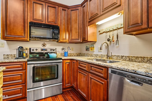206 Lisa Dr, Carrboro, NC 27510 - kitchen with stainless steel appliances, dark wood finished floors, and light stone counters