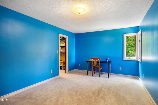 206 Lisa Dr, Carrboro, NC 27510 - spare room with a textured ceiling and carpet