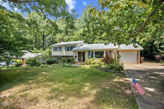 619 Ashe Ave, Cary, NC 27511 - tri-level home with driveway, an attached garage, a chimney, and a front yard