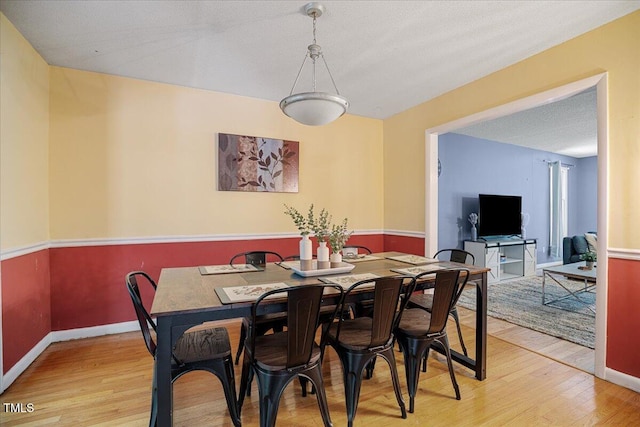 619 Ashe Ave, Cary, NC 27511 - dining room featuring light wood-type flooring and baseboards