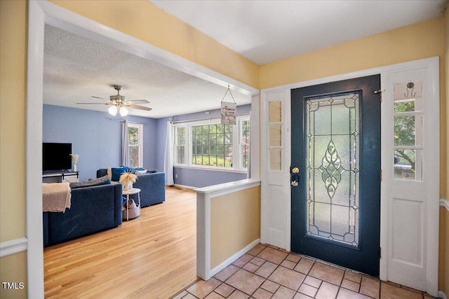 619 Ashe Ave, Cary, NC 27511 - entryway with ceiling fan and wood finished floors