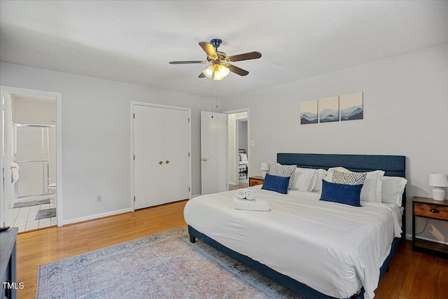 619 Ashe Ave, Cary, NC 27511 - bedroom with wood finished floors, ensuite bathroom, and a ceiling fan