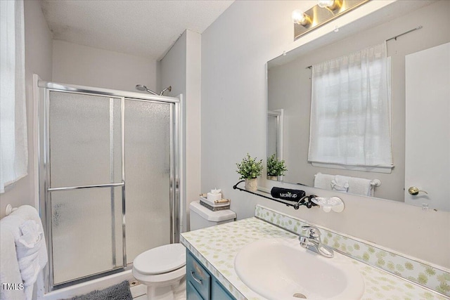 619 Ashe Ave, Cary, NC 27511 - full bath featuring vanity, a shower stall, and a textured ceiling