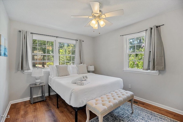 619 Ashe Ave, Cary, NC 27511 - bedroom featuring wood finished floors and a ceiling fan