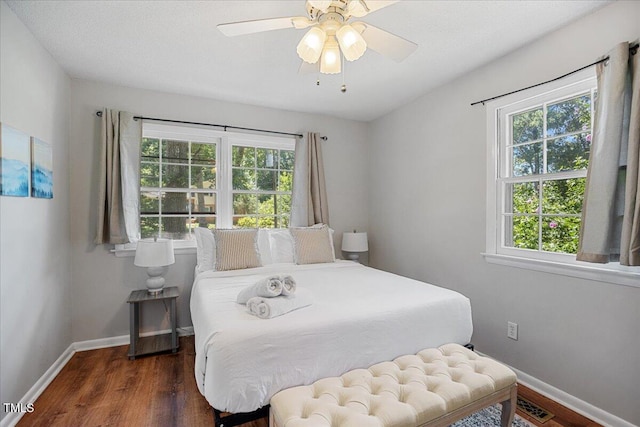 619 Ashe Ave, Cary, NC 27511 - bedroom with multiple windows and wood finished floors