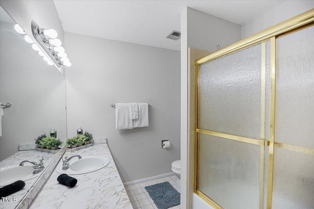 619 Ashe Ave, Cary, NC 27511 - bathroom featuring double vanity, tile patterned flooring, and a shower with shower door