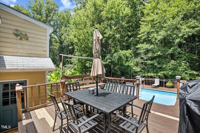 619 Ashe Ave, Cary, NC 27511 - deck with outdoor dining area and view of scattered trees