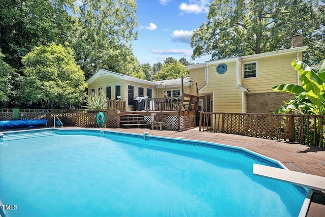619 Ashe Ave, Cary, NC 27511 - view of swimming pool with a deck and a diving board