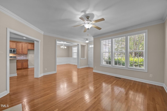 1012 Palace Garden Way, Raleigh, NC 27603 - unfurnished living room with a chandelier, light wood-style floors, a ceiling fan, and crown molding