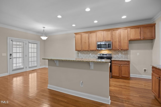 1012 Palace Garden Way, Raleigh, NC 27603 - kitchen with appliances with stainless steel finishes, decorative backsplash, wood finished floors, light stone counters, and brown cabinets