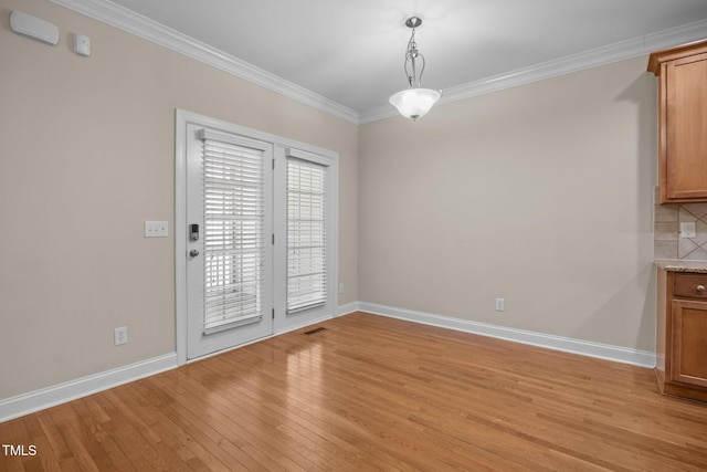 1012 Palace Garden Way, Raleigh, NC 27603 - unfurnished dining area featuring ornamental molding and light wood-style flooring