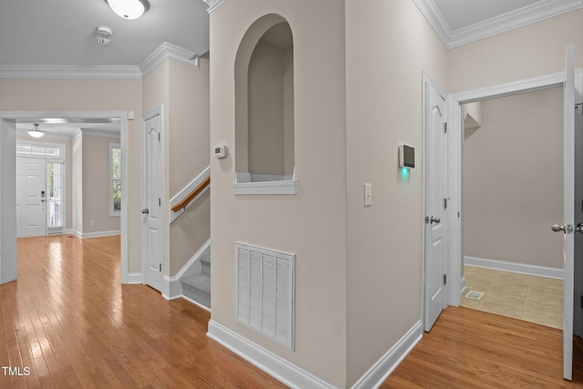 1012 Palace Garden Way, Raleigh, NC 27603 - hallway featuring crown molding, hardwood / wood-style floors, and stairway