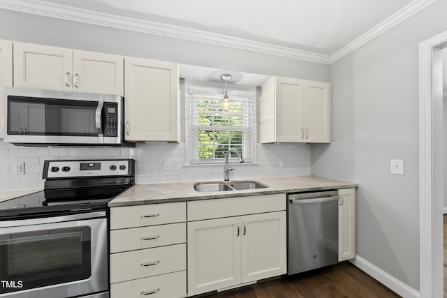 405 E Millbrook Rd, Raleigh, NC 27609 - kitchen with stainless steel appliances, crown molding, decorative backsplash, white cabinets, and light stone countertops