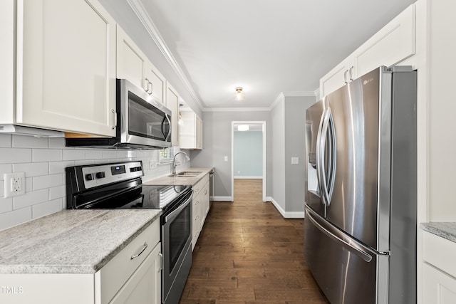 405 E Millbrook Rd, Raleigh, NC 27609 - kitchen featuring appliances with stainless steel finishes, crown molding, decorative backsplash, dark wood finished floors, and white cabinets