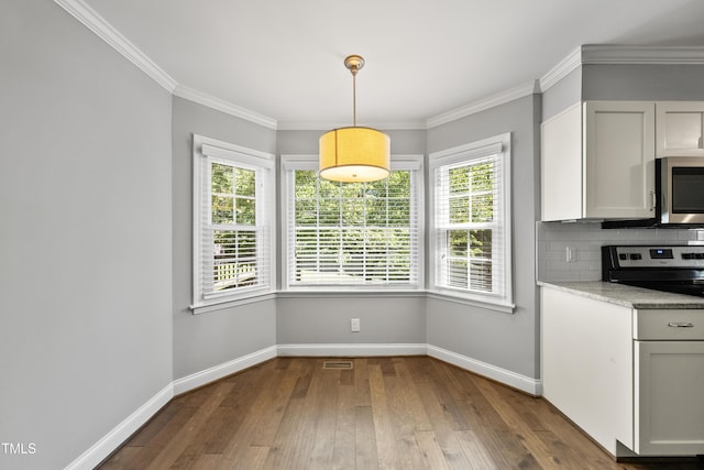 405 E Millbrook Rd, Raleigh, NC 27609 - unfurnished dining area with healthy amount of natural light, hardwood / wood-style floors, and crown molding