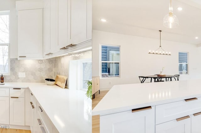 322 S Dixon Ave Unit R, Cary, NC 27511 - kitchen with tasteful backsplash, a chandelier, light countertops, plenty of natural light, and recessed lighting