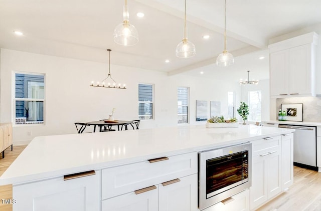 322 S Dixon Ave Unit R, Cary, NC 27511 - kitchen featuring built in microwave, stainless steel dishwasher, a chandelier, recessed lighting, and light wood-style floors