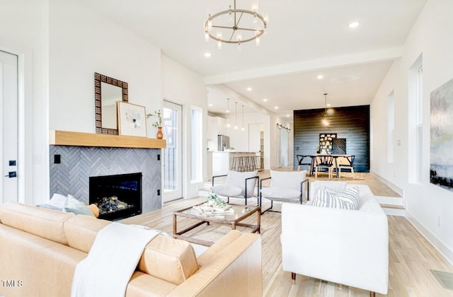 322 S Dixon Ave Unit R, Cary, NC 27511 - living area with a fireplace, a chandelier, light wood-type flooring, and recessed lighting