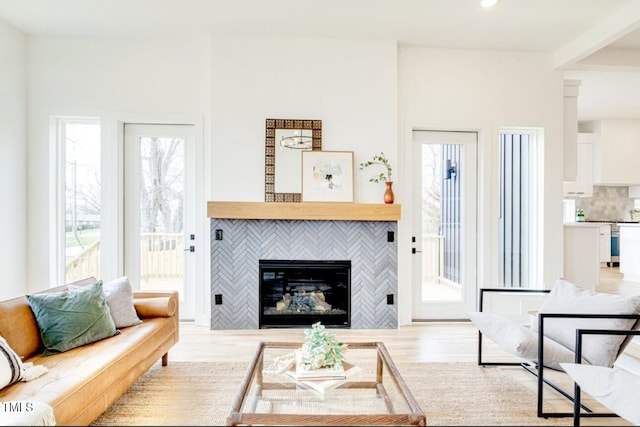 322 S Dixon Ave Unit R, Cary, NC 27511 - living room with wood finished floors, a tiled fireplace, and recessed lighting