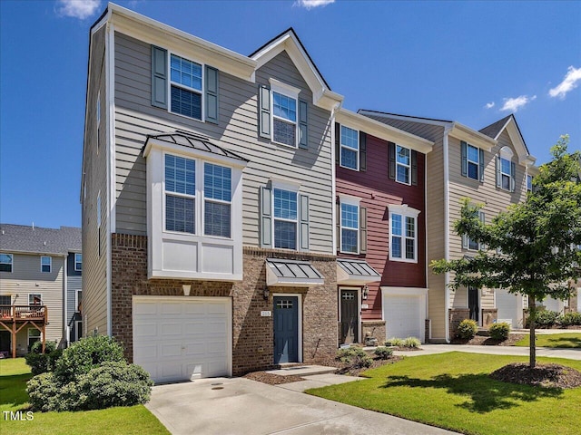 215 Brier Summit Pl, Durham, NC 27703 - townhome / multi-family property with an attached garage, concrete driveway, a residential view, and a front yard
