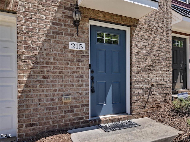 215 Brier Summit Pl, Durham, NC 27703 - view of exterior entry with brick siding