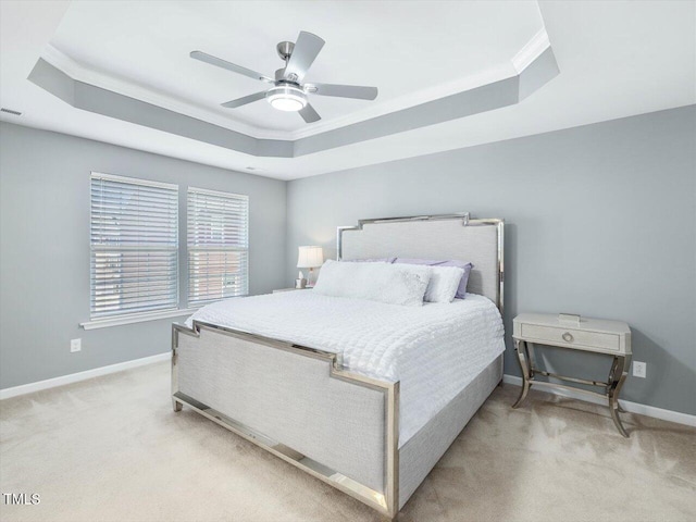 215 Brier Summit Pl, Durham, NC 27703 - bedroom with a tray ceiling, light carpet, ornamental molding, and ceiling fan