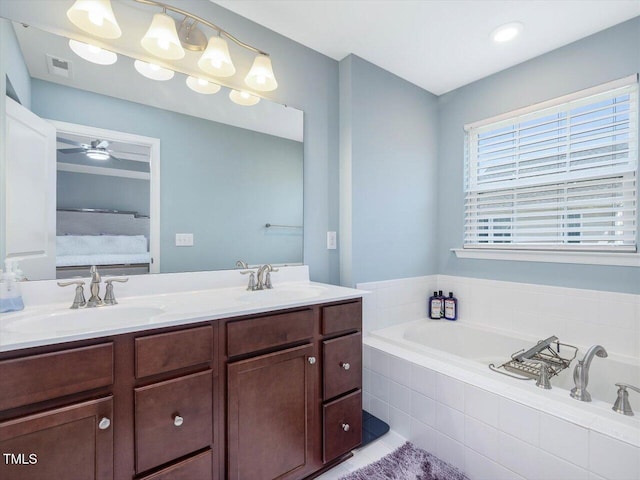 215 Brier Summit Pl, Durham, NC 27703 - bathroom featuring a bath, double vanity, and ceiling fan