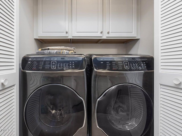 215 Brier Summit Pl, Durham, NC 27703 - washroom with washer and dryer and cabinet space