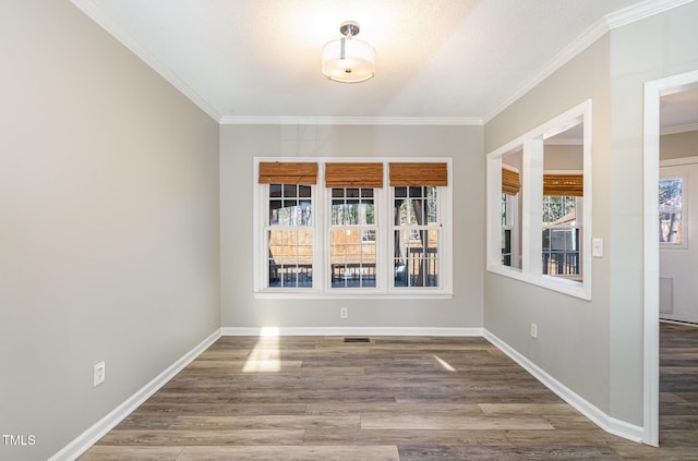 112 Solstice Cir, Cary, NC 27513 - unfurnished dining area featuring wood finished floors and crown molding