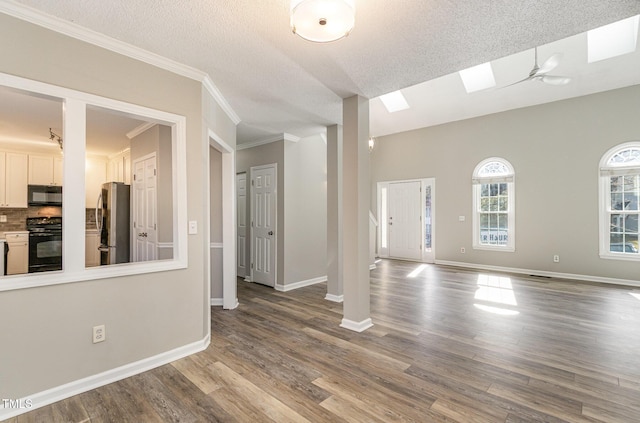 112 Solstice Cir, Cary, NC 27513 - spare room with wood finished floors, a textured ceiling, crown molding, and a skylight