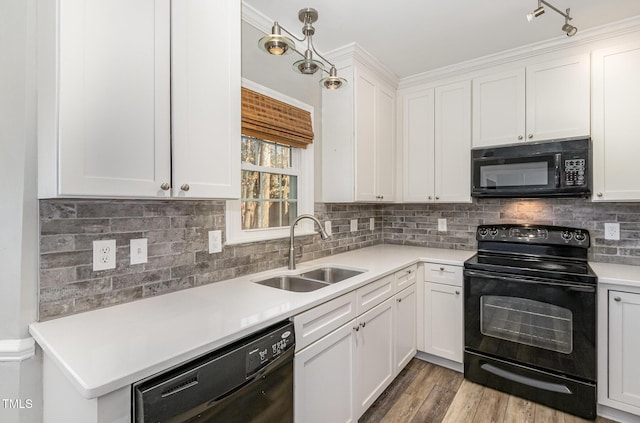 112 Solstice Cir, Cary, NC 27513 - kitchen with black appliances, light countertops, white cabinets, and backsplash