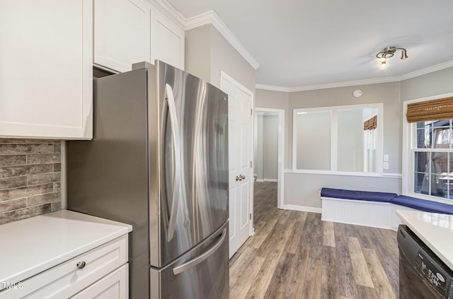 112 Solstice Cir, Cary, NC 27513 - kitchen featuring freestanding refrigerator, dishwasher, white cabinets, wood finished floors, and light countertops