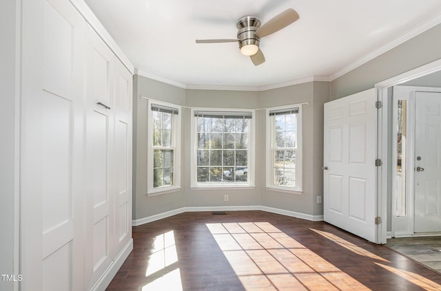 112 Solstice Cir, Cary, NC 27513 - entryway featuring dark wood-style flooring, a ceiling fan, and crown molding