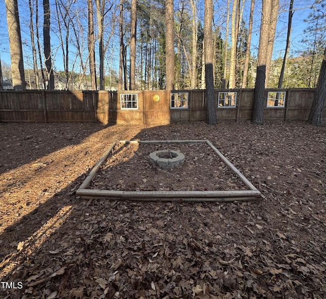 112 Solstice Cir, Cary, NC 27513 - fenced backyard with an outdoor fire pit