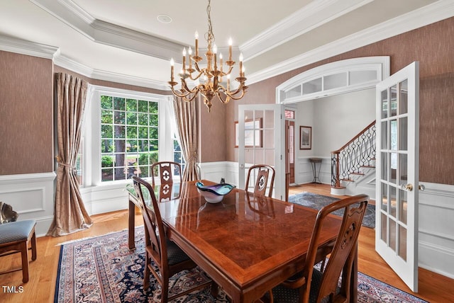 3606 Dairy Pond Pl, Durham, NC 27705 - dining room featuring french doors, a chandelier, a wainscoted wall, ornamental molding, and stairs