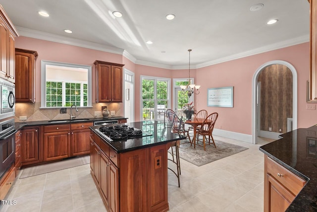 3606 Dairy Pond Pl, Durham, NC 27705 - kitchen with stainless steel appliances, a kitchen breakfast bar, backsplash, recessed lighting, and dark stone counters