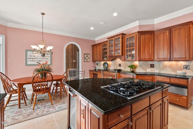 3606 Dairy Pond Pl, Durham, NC 27705 - kitchen with black gas stovetop, brown cabinets, arched walkways, light tile patterned floors, and recessed lighting