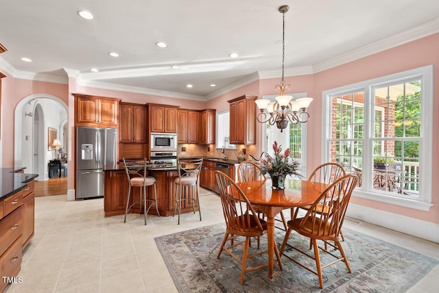 3606 Dairy Pond Pl, Durham, NC 27705 - dining space featuring arched walkways, a chandelier, healthy amount of natural light, light tile patterned floors, and crown molding