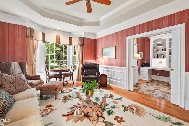 3606 Dairy Pond Pl, Durham, NC 27705 - sitting room featuring wood finished floors, a raised ceiling, ceiling fan, and ornamental molding
