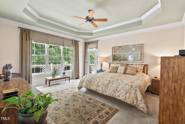3606 Dairy Pond Pl, Durham, NC 27705 - carpeted bedroom featuring a tray ceiling, ornamental molding, and a ceiling fan