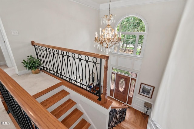 3606 Dairy Pond Pl, Durham, NC 27705 - stairs with a chandelier, crown molding, and wood finished floors