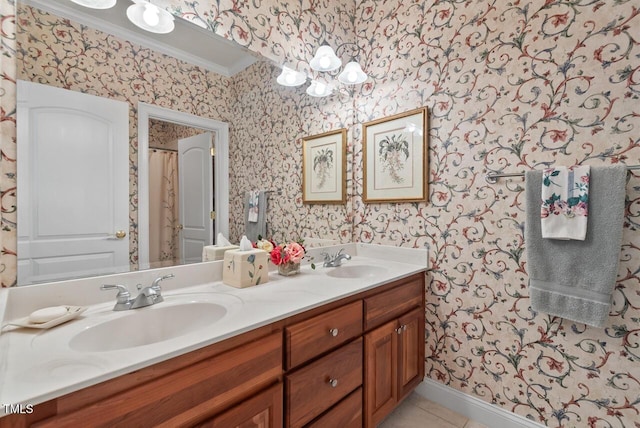 3606 Dairy Pond Pl, Durham, NC 27705 - full bath with wallpapered walls, double vanity, tile patterned floors, a chandelier, and ornamental molding