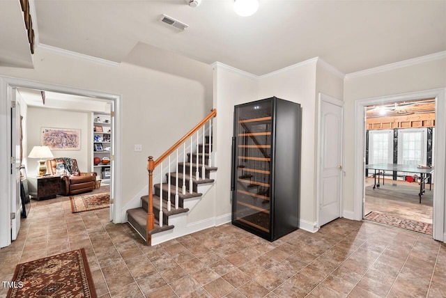 3606 Dairy Pond Pl, Durham, NC 27705 - stairway featuring beverage cooler, ornamental molding, and stone finish flooring